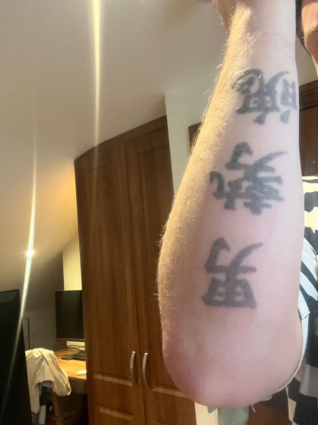 Forearm lettering tattoo after treatment